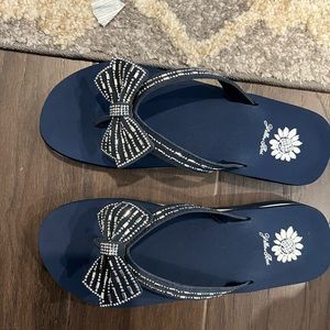Brand new, in box, never worn Yellow Box navy “Hola” flip flops size 7.5.